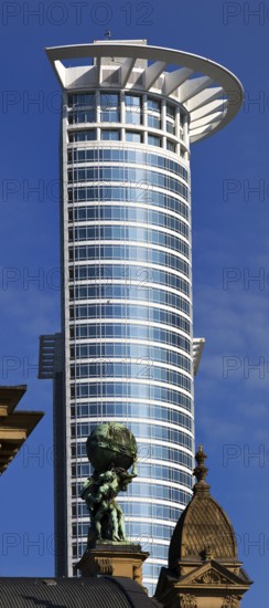 Central station with Atlas carrying the globe on his shoulders in front of the DZ Bank tower block, Frankfurt am Main, Hesse, Germany