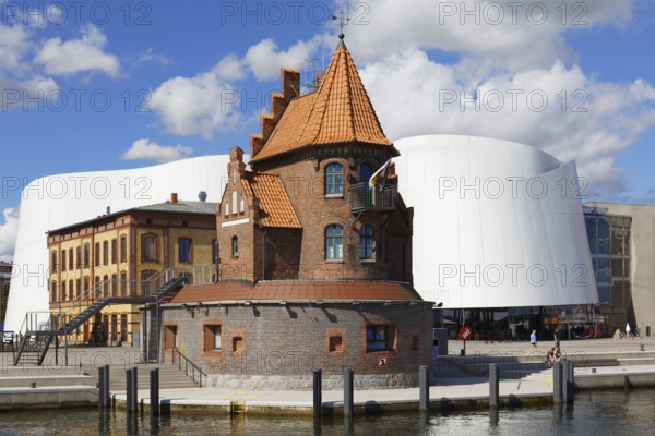 Two-storey brick building in front of Ozeaneum, formerly built as pilot house, pilot watch 1901, today harbour office, Hafenstraße 50, harbour island, old town, UNESCO World Heritage Site, Hanseatic City of Stralsund, Mecklenburg-Western Pomerania, Germany