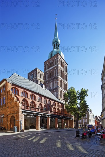 Rear towers St. Nikolai Church first mentioned in 1276, 102 metres high, in front town hall construction started around 1300, secular building, brick Gothic, view from south-west, Ossenreyer Str. corner Badenstraße, Old Town, UNESCO World Heritage Site, Hanseatic City of Stralsund, Mecklenburg-Western Pomerania, Germany