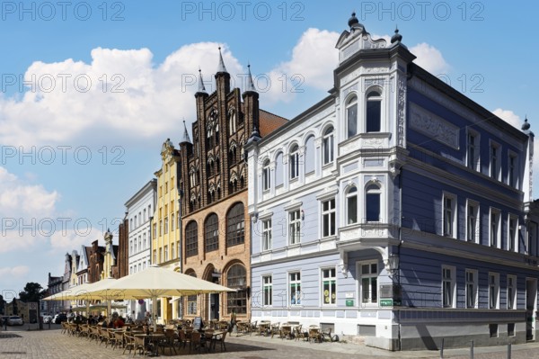 Magnificent town houses, building on the right neo-Renaissance, centre gabled house, brick Gothic, in front of it open-air seating, Alter Markt north side, Old Town, UNESCO World Heritage Site, Hanseatic City of Stralsund, Mecklenburg-Western Pomerania, Germany