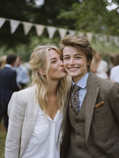 A same-sex couple in a suit, one kissing the other on the cheek, surrounded by guests outdoors, symbolic image for same-sex marriage, love, LGBTQ, AI generated, AI generated
