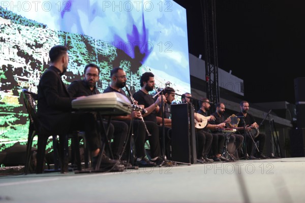 A Kurdish music group performs on stage during the Damascus International Fair, the first edition held after the fall of Bashar al-Assad, presenting traditional and modern Kurdish music to visitors, Damascus, Damascus, Syria