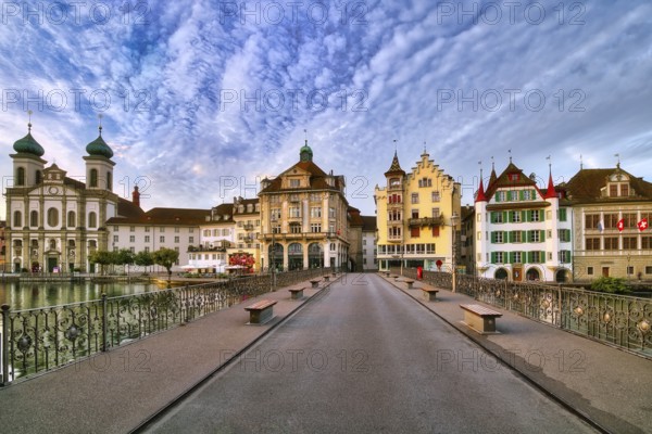 View from the Reuss bridge onto the old town of Lucerne with Jesuit church, decorative cloudy atmosphere, Canton Lucerne, Switzerland