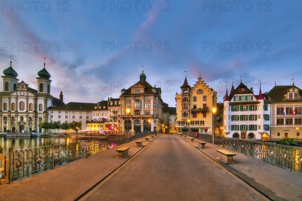 View of Lucerne's old town with Jesuit church from the Reuss bridge at dawn, Canton of Lucerne, Switzerland