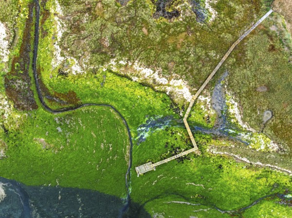 Top Down over River Hamble Mud at low tide from drone, Swanwick, Southampton, Hampshire, England, United Kingdom