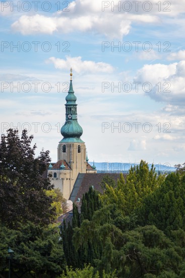 Church tower of St Stephan in Baden in front of a blue sky with clouds, Baden, Lower Austria, Austria