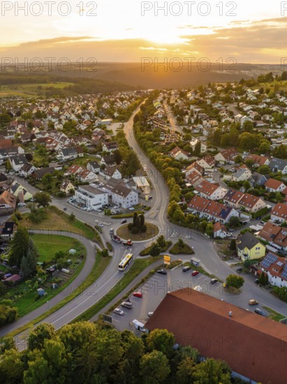 Urban settlement with red roofs and winding streets in the setting sun, small town pearl Calw, Black Forest, Germany
