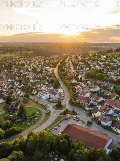 Residential neighbourhood with red roofs and winding streets at a gentle sunset, small town pearl Calw, Black Forest, Germany