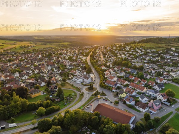 Urban landscape with houses and streets in gentle evening sun, surrounded by hills, small town pearl Calw, Black Forest, Germany