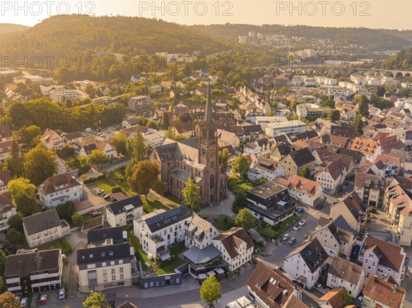 Aerial view of a town with a church in the centre and surrounding historic buildings, small town of Perle Nagold, Black Forest, Germany