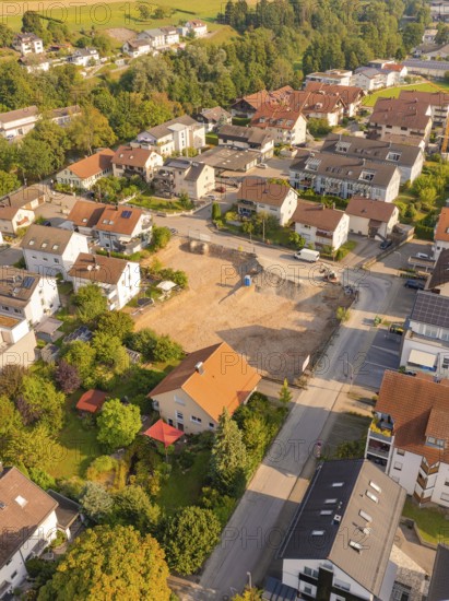 Aerial view of a residential area with building site and surrounding natural areas, small town of Perle Nagold, Black Forest, Germany