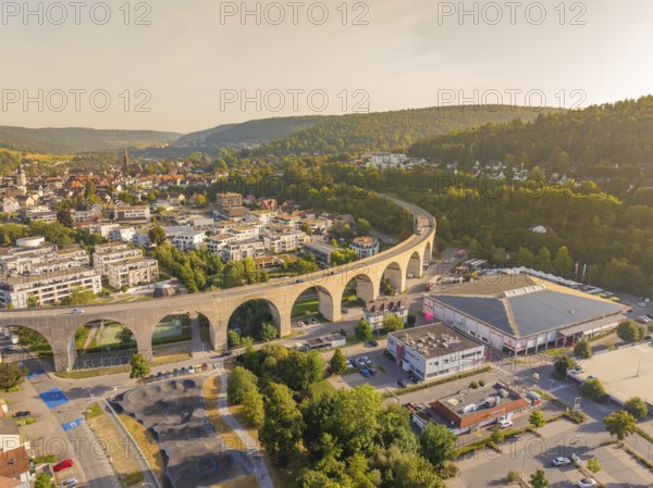 Town view with dominating viaduct running through an urban and natural landscape, small town pearl Nagold, Black Forest, Germany