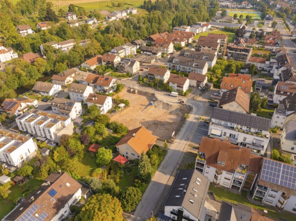 Quiet residential area with newly built area, surrounded by greenery and solar panels, small town pearl Nagold, Black Forest, Germany