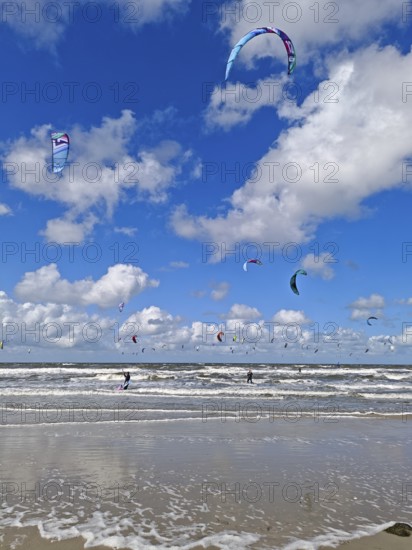 California kitesurfing Masters 2025, kitesurfing on the North Sea beach on the edge of the UNESCO World Heritage Wadden Sea, sports competition, strong wind, high swell, whitecaps, summer, sun, blue sky, white clouds, Ording, Sankt Peter-Ording, Schleswig-Holstein, Germany