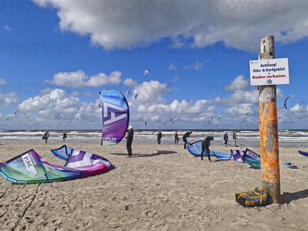 California kitesurfing Masters 2025, kitesurfing on the North Sea beach on the edge of the UNESCO World Heritage Wadden Sea, sports competition, strong wind, high swell, no swimming sign, whitecaps, summer, sun, blue sky, white clouds, Ording, Sankt Peter-Ording, Schleswig-Holstein, Germany