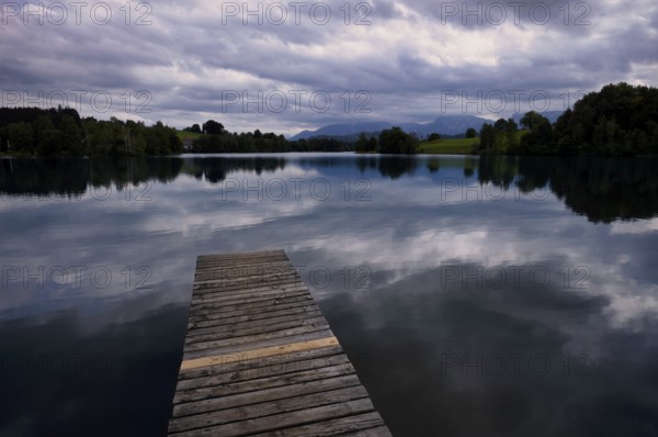 Bathing jetty, jetty, wooden jetty, jetty, leads into a lake, bathing lake, Schwaltenweiher near Seeg, Allgäu Alps, East Allgäu, Allgäu, Swabia, Bavaria, Germany