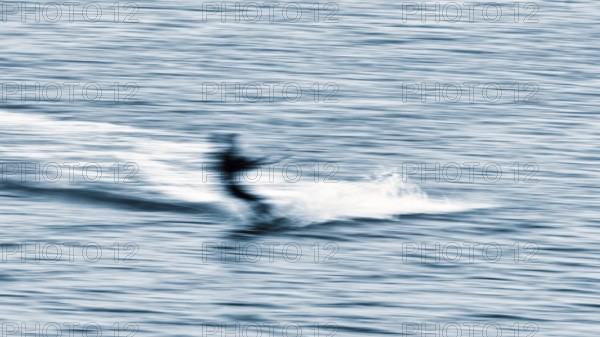Kitesurfer in the surf, wiping effect, long exposure, Sankt Peter-Ording, Eiderstedt peninsula, Wadden Sea National Park, North Frisia, Schleswig-Holstein, Germany