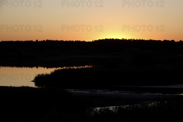 Landscape with lake, rising sun, August, Saxony, Germany