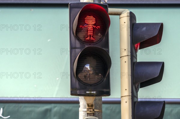 Pumuckel figure in a pedestrian traffic light, Munich, Bavaria, Germany