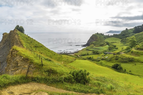 Scenic landscape showcasing the unique flysch rock formations along the coast of sakoneta beach in zumaia, gipuzkoa, basque country, spain