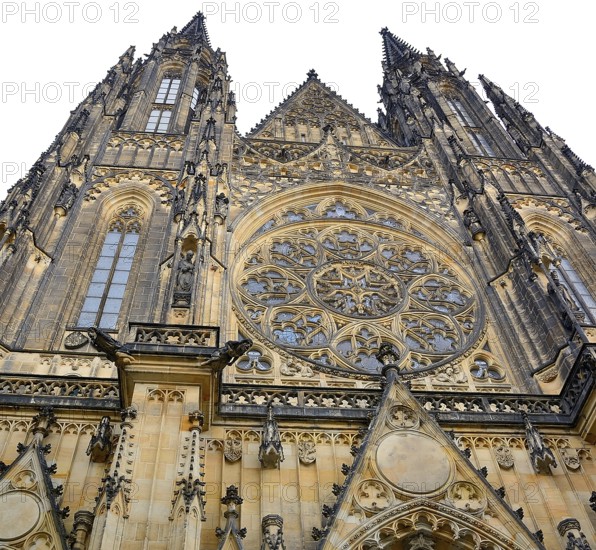 Low angle view of the richly decorated facade of st. Vitus cathedral in prague, czech republic, highlighting its intricate rose window and gargoyles