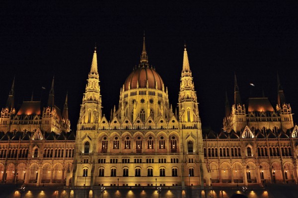 Majestic hungarian parliament building glowing at night, showcasing its stunning architecture and reflecting in the danube river