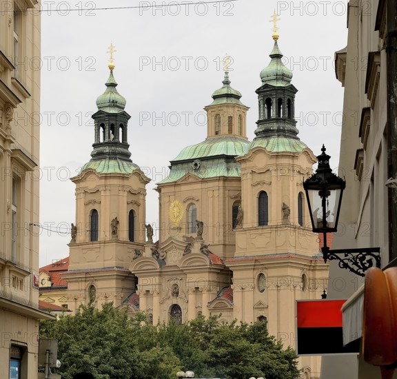 Church towers rising above the cityscape of prague, showcasing the city's rich architectural heritage and spiritual significance
