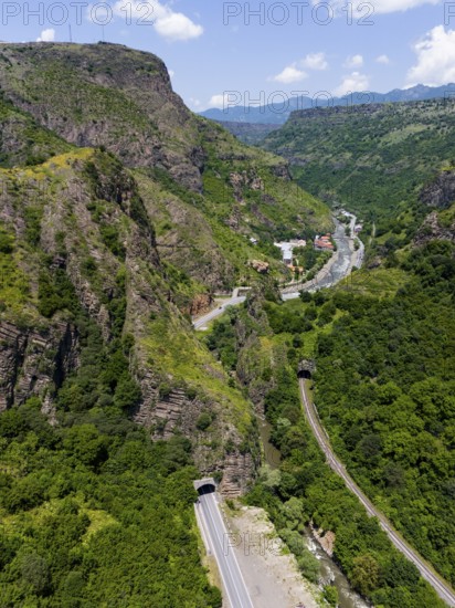 Landscape with road and tunnel between forested mountains and river, aerial view, landscape near Dzoraget, river Pambak in front of the tunnel, river Debed, gorge Debed, Lorikeet province, Armenia