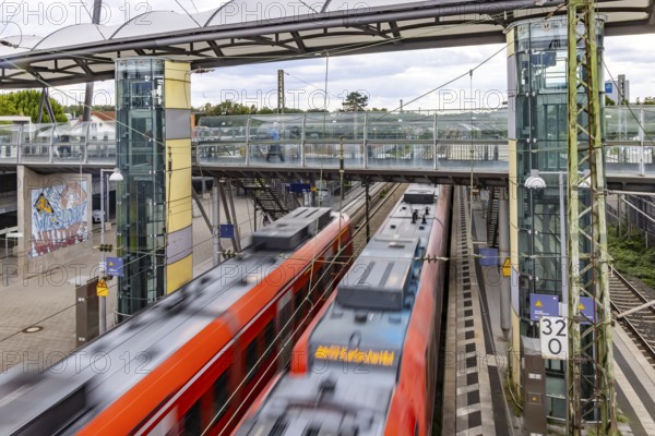 Railway station with passing S-Bahn in Walldorf-Wiesloch. Wiesloch, Baden-Württemberg, Germany