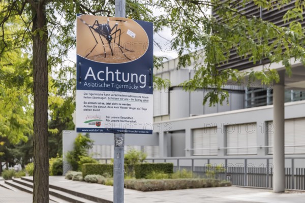 Attention Asian tiger mosquito (Aedes albopictus) . Poster with hazard warning and rules of behaviour for the population in the town of Walldorf. Walldorf Baden-Württemberg, Germany