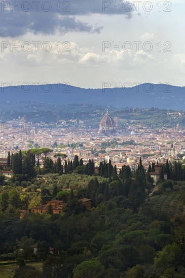 Panoramic view of the city of Florence with dome amidst Tuscan hills in Italy