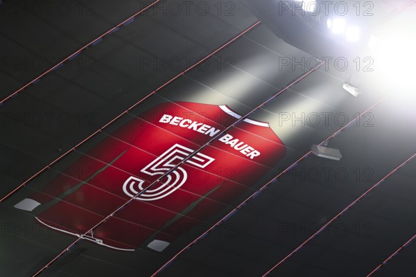 Larger-than-life jersey of Emperor Franz Beckenbauer with shirt number 5 hangs in the grandstand roof of the south curve, 125th anniversary of FC Bayern Munich FCB, radiance, Allianz Arena, Munich, Bavaria, Germany