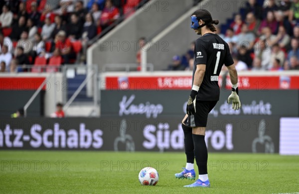 Goalkeeper Kamil Grabara VfL Wolfsburg (01) with face mask Carbon mask Action Voith-Arena, Heidenheim, Baden-Württemberg, Germany