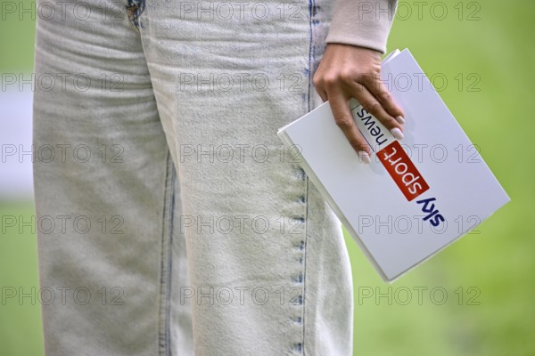 SKY presenter Mara Mones with presentation card Logo Detail Close-up Feature Voith-Arena, Heidenheim, Baden-Württemberg, Germany