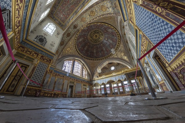 Wide angle view of the richly decorated interior of topkapi palace, showcasing intricate ottoman architecture and design