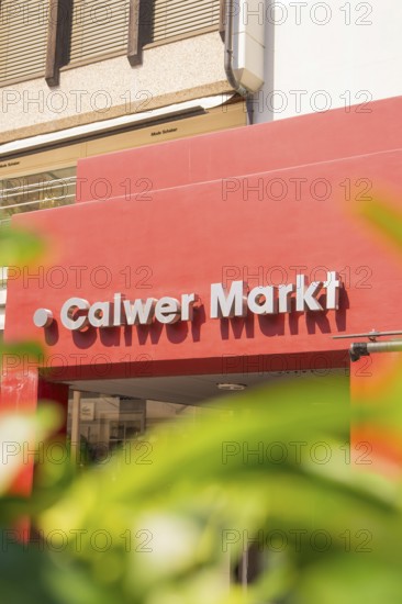 Calw market sign on a modern building, framed by plants, small town pearl Calw, Black Forest, Germany