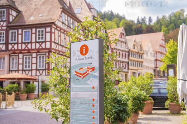 Information board about the Calw market with picturesque half-timbered houses in the background, small town pearl Calw, Black Forest, Germany
