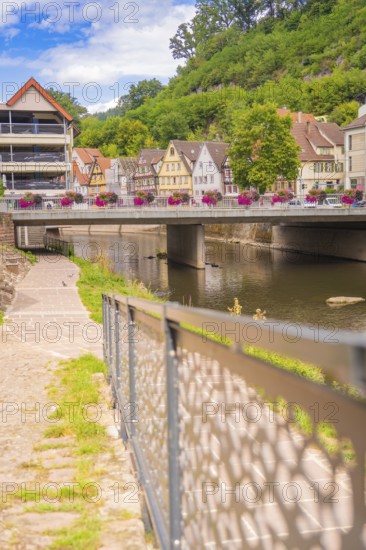 Modernised bridge over a river in an urban setting on a summer's day, small town of Perle Calw, Black Forest, Germany