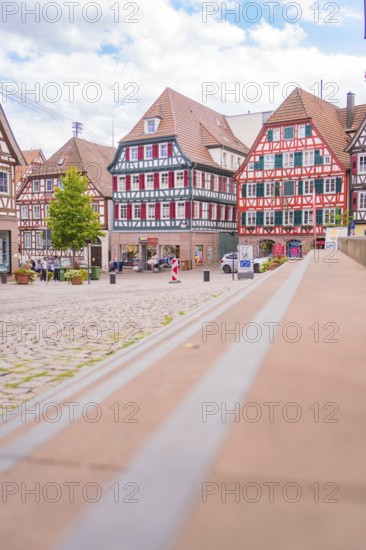 View of a picturesque market square with half-timbered houses in historical style, small town of Perle Calw, Black Forest, Germany