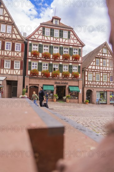Inviting atmosphere with half-timbered houses and floral decorations, small town pearl Calw, Black Forest, Germany