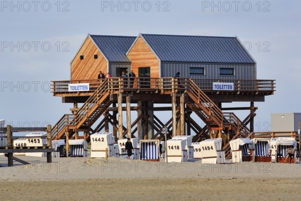 Pile dwelling, toilet house on the beach, beach chairs, strollers, Sankt Peter-Ording, Eiderstedt peninsula, Wadden Sea National Park, North Sea, North Frisia, Schleswig-Holstein, Germany