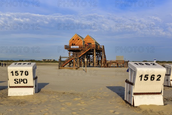 Pile dwelling, toilet house on the beach, beach chairs, Sankt Peter-Ording, Eiderstedt peninsula, Wadden Sea National Park, North Sea, North Frisia, Schleswig-Holstein, Germany