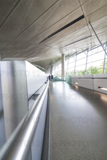 Long corridor with glass walls, deserted, futuristic atmosphere, BMW Welt, Munich, Germany