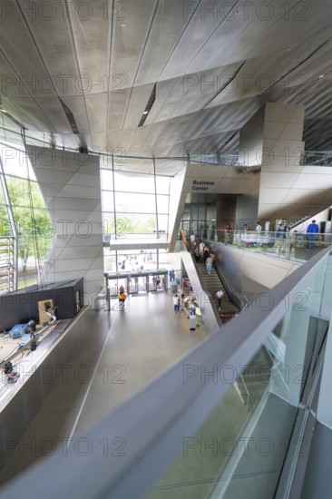 Large modern interior with visitors and striking architectural elements, BMW Welt, Munich, Germany