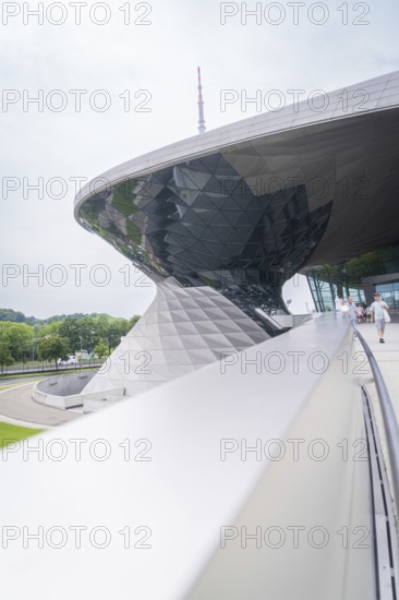 Futuristic building with curved roof and characteristic glass structures, BMW Welt, Munich, Germany