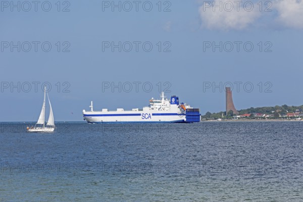 Sailing boat, cargo ship, naval memorial, Laboe, Kiel Fjord, Schleswig-Holstein, Germany