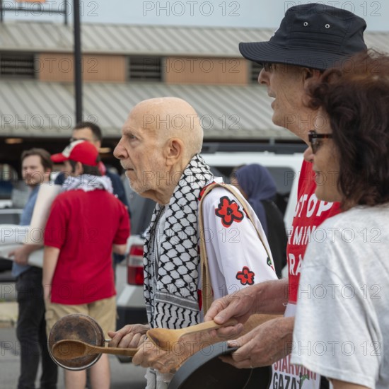 Detroit, Michigan USA - 23 August 2025 - Protesters rally at Eastern Market, banging empty pots to protest starvation in Gaza