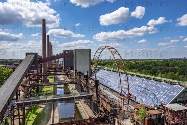 The Zollverein coking plant, backdrop to the once largest central coking plant in Europe, closed in 1993, part of the Zollverein Coal Mine Industrial Complex UNESCO World Heritage Site, Essen, North Rhine-Westphalia, Germany