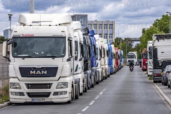 Truck tractors, exclusively from Eastern European countries, park in the harbour area, the canal port of Herne, the drivers wait for the next transport operation, spend their rest periods there, North Rhine-Westphalia, Germany