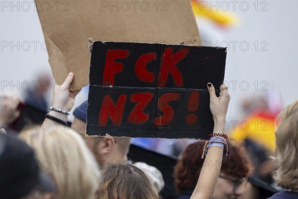 Counter-demonstration against the rally of AfD politician Joachim Paul in Ludwigshafen-Oggersheim***Picture: Sign with the inscription FCK NZS (Fuck Nazis)